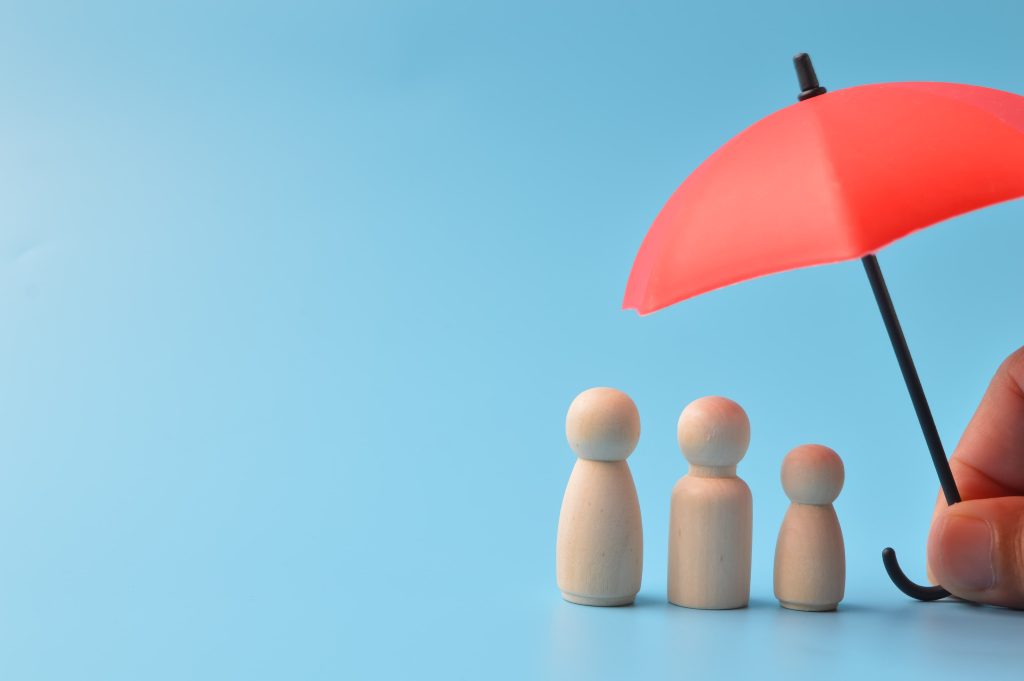 Chess pawns under umbrella